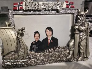 Viking-Themed Norway Photo Frame with Formal Portrait Viking-themed frame with Norway flags, Viking, ship; two people in photo, text overlay below.